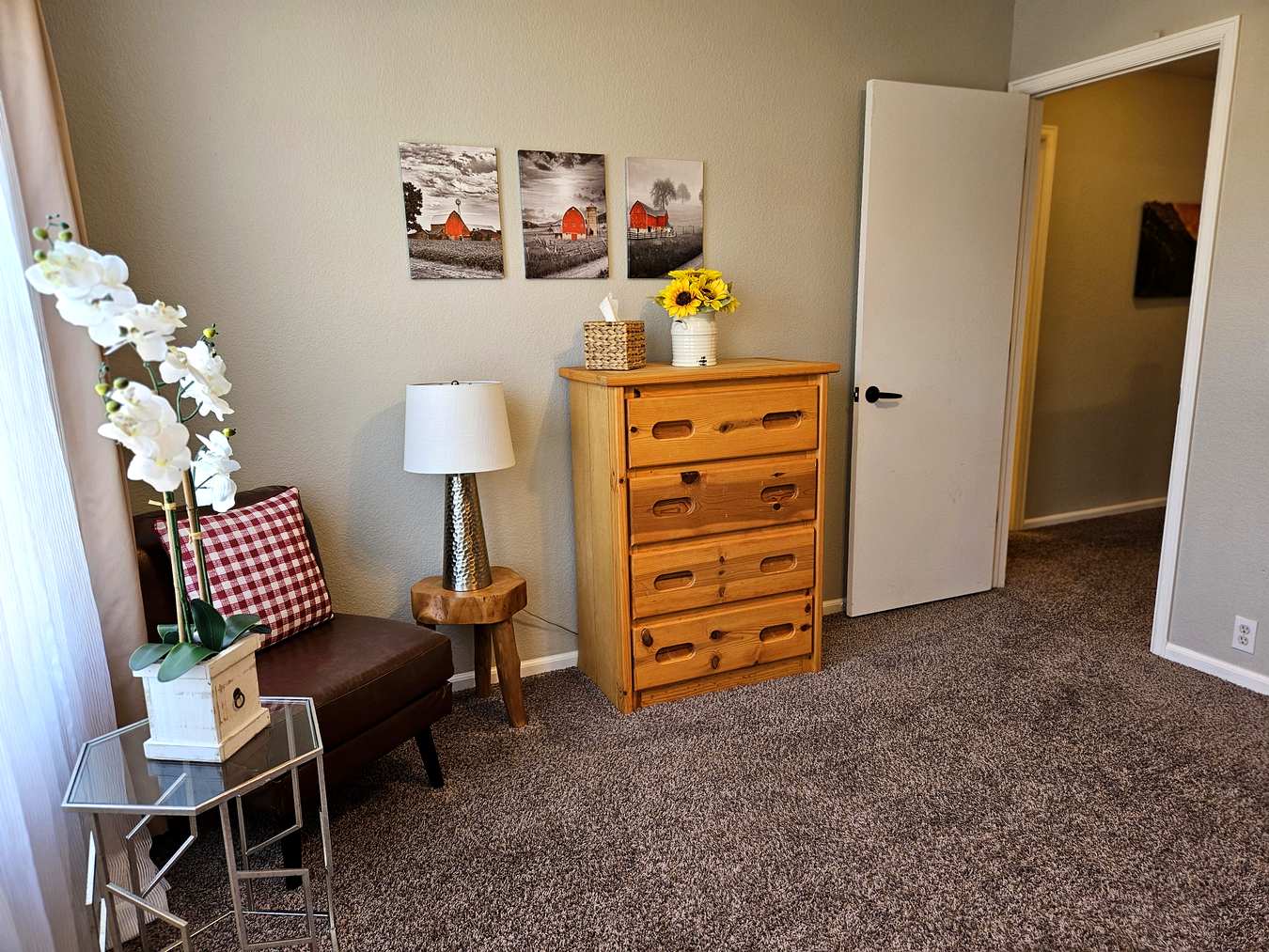 Bedroom dresser with sunflowers and farmhouse wall art