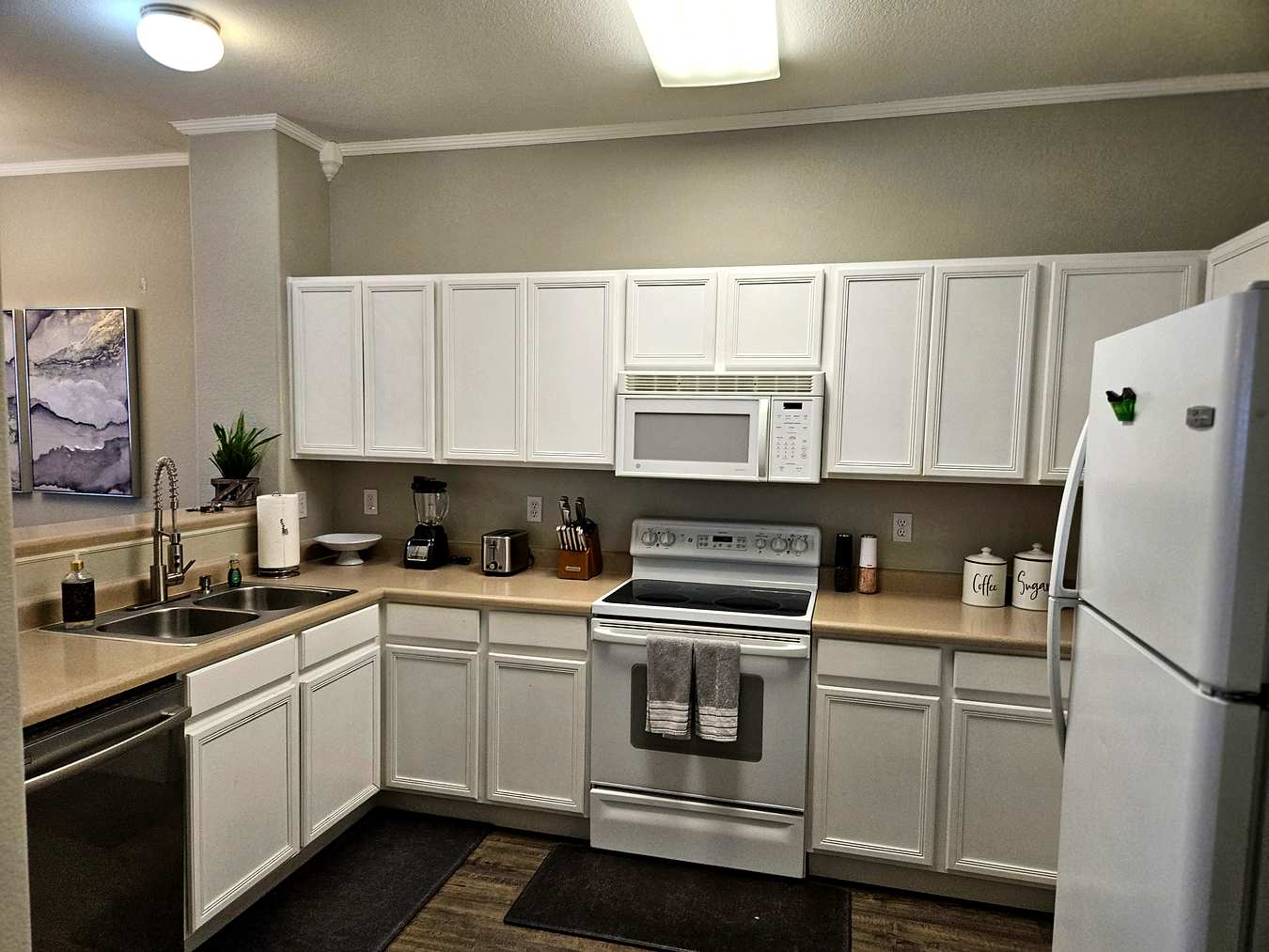 Full kitchen with white cabinets