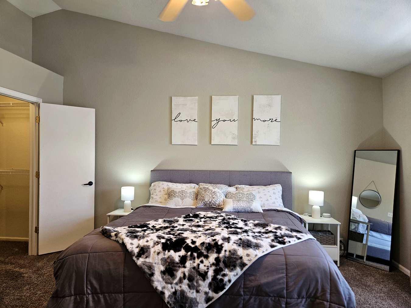 Master bedroom with vaulted ceiling and king bed