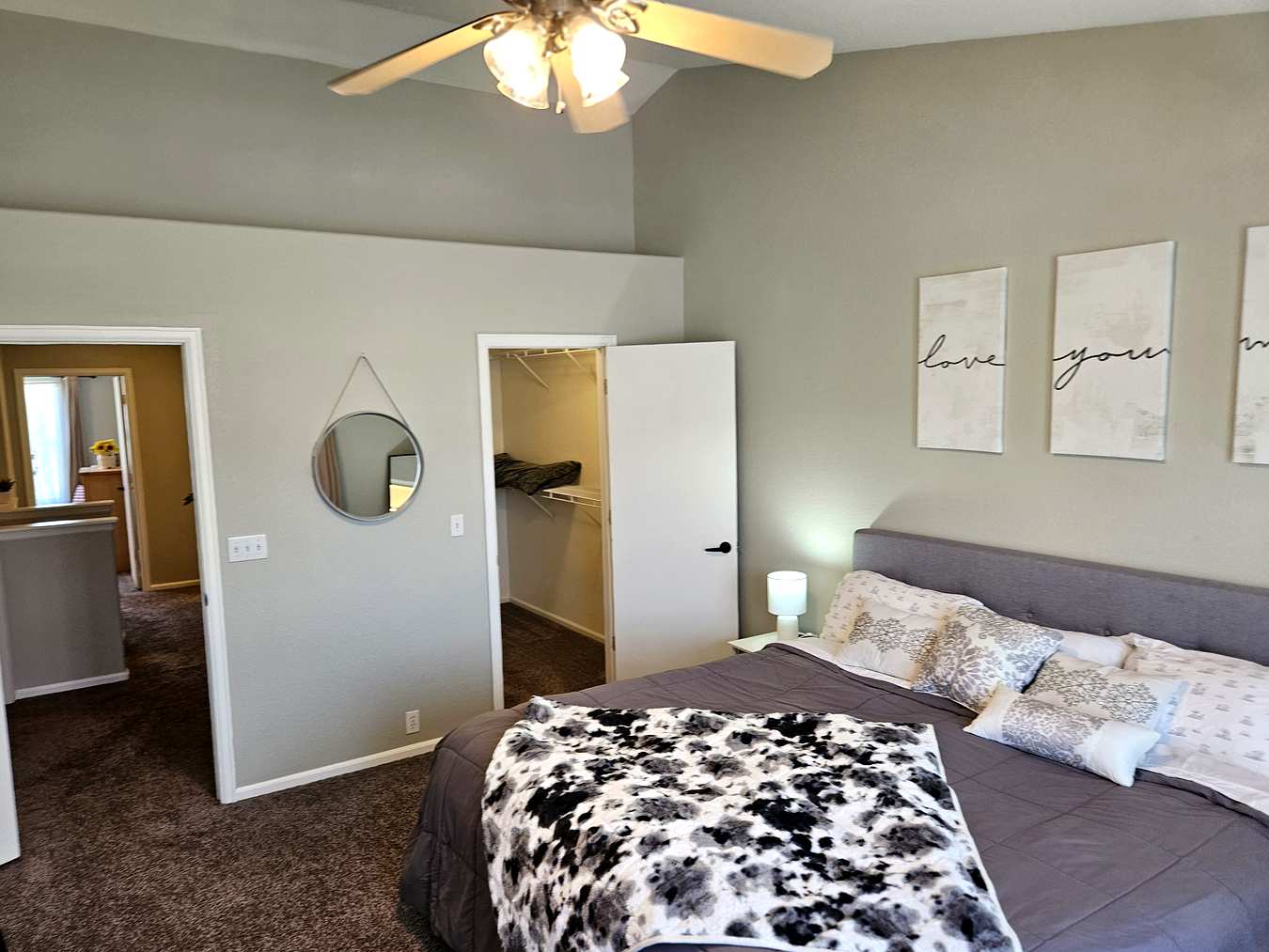 Master suite showing walk-in closet and en-suite bathroom entrance