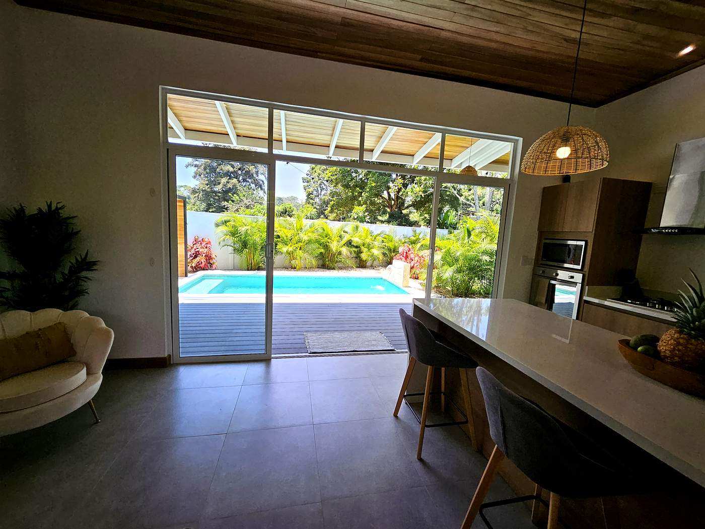 Open living area with sliding glass doors to private pool