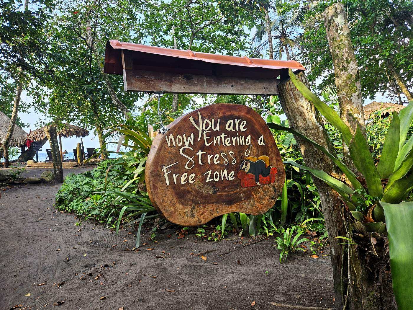 Stress Free Zone welcome sign surrounded by tropical jungle